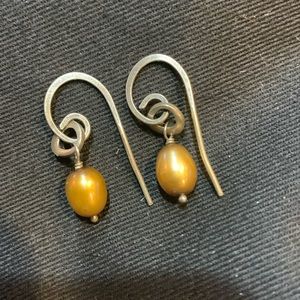 Silpada earrings. 925 silver posts with yellow/gold colored oval drop design
